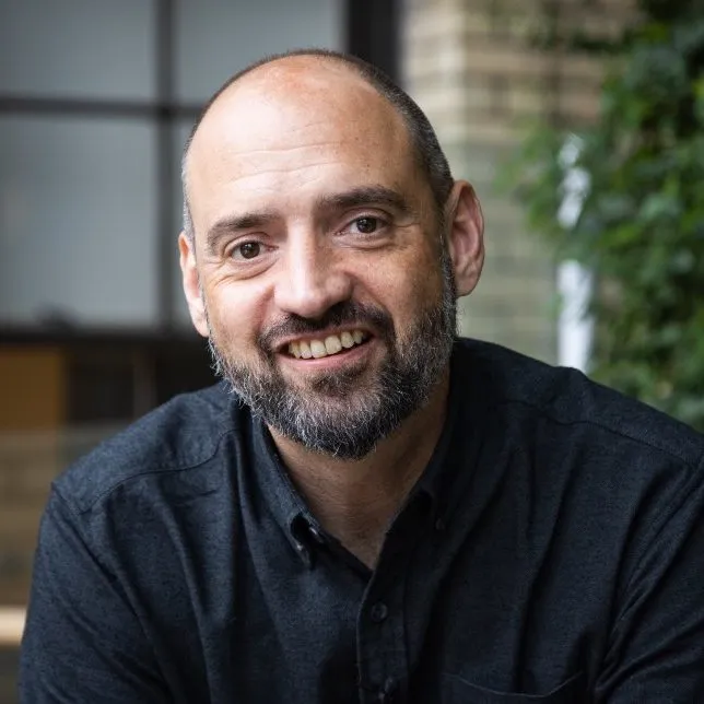 Photo of Robert Soden, wearing a black shirt