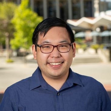 Richmond Wong, wearing glasses, and a blue collared shirt