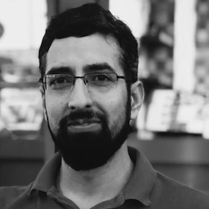 Image of Haroon Lone, in black and white, wearing a polo.